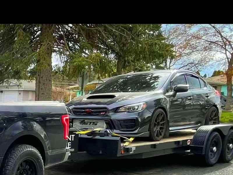 Transporting sports car to track event with secure Titan Trailer rental in Spokane area